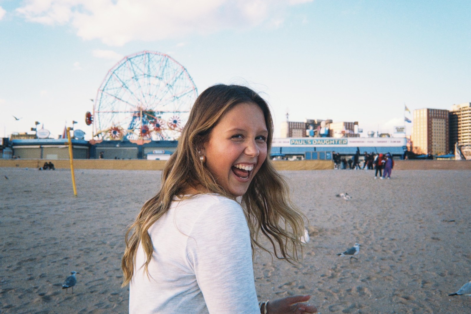 Frances Miculis laughing on the boardwalk